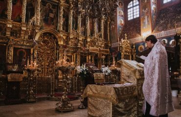 Priest in church